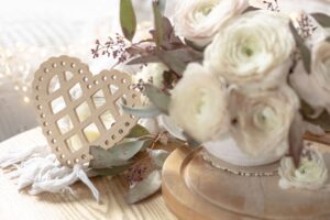bouquet white ranunculus flowers blurred background with heart min
